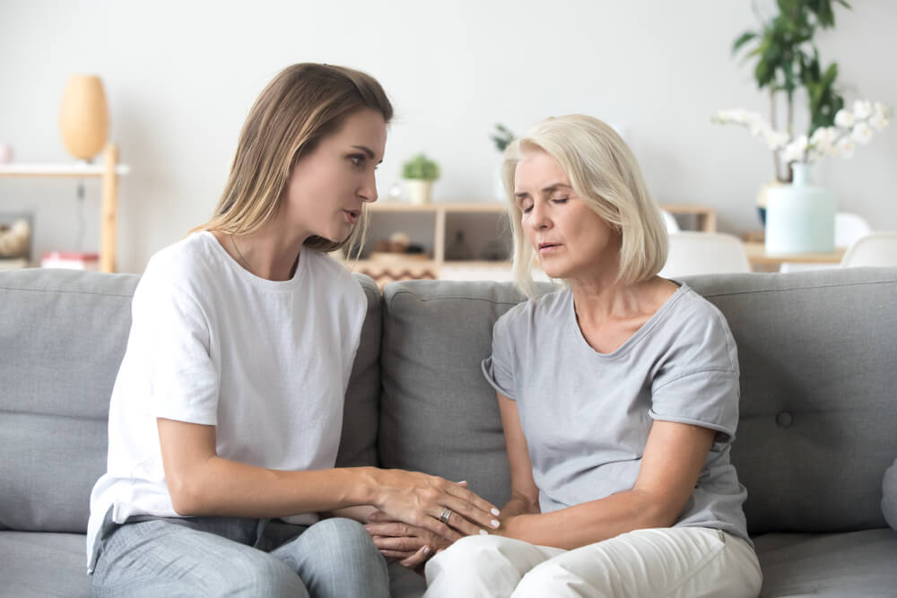 Woman Speaking To Her Mother With Alzheimer's