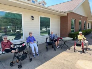 Residents at Three Forks Senior Living of Forney protect themselves from UV rays by sitting in the shade, wearing covering clothing, and sunglasses!